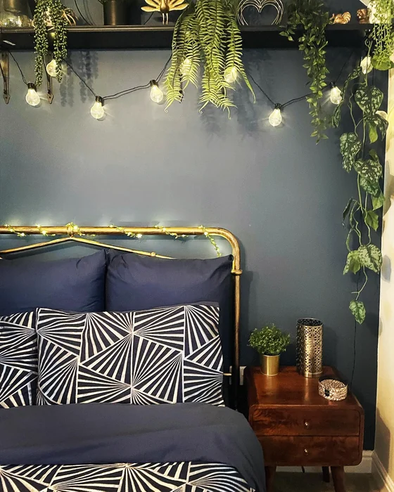 Shelf Above Bed with Greenery & String Lights