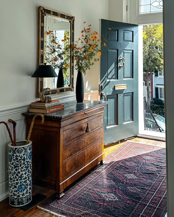Classic Entryway with Antique Chest and Gold Mirror
