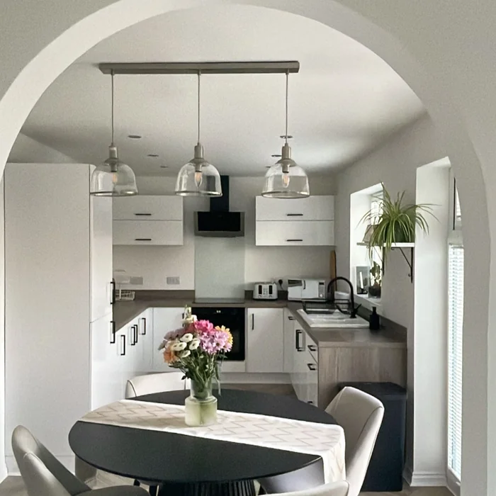 Simple Modern Round Kitchen Table with Fresh Flower Centerpiece