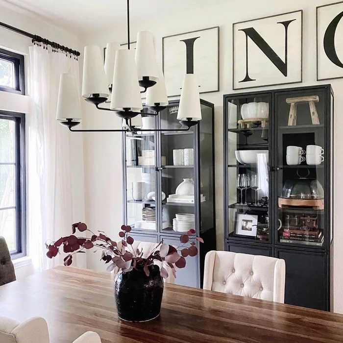Oversized Letter Art Above Glass Display Cabinets