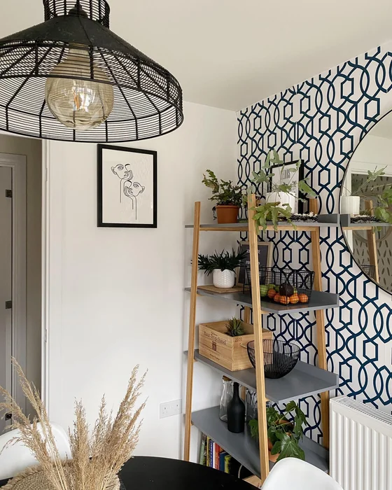 Geometric Accent Wallpaper with Ladder Shelf Decor