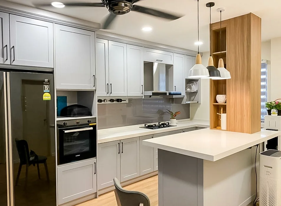 Modern Gray Kitchen with Wood Accent Tower and Pendant Lights