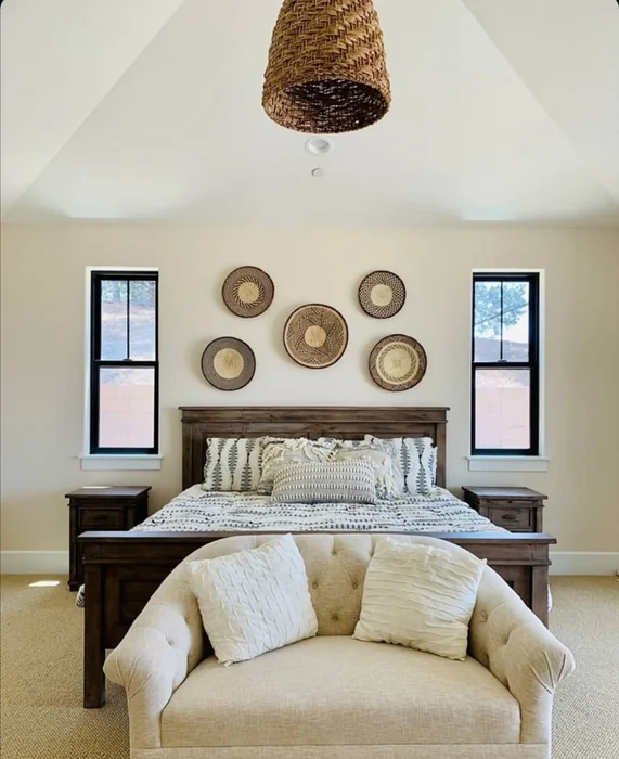 Woven Basket Wall Decor Above Farmhouse Master Bed