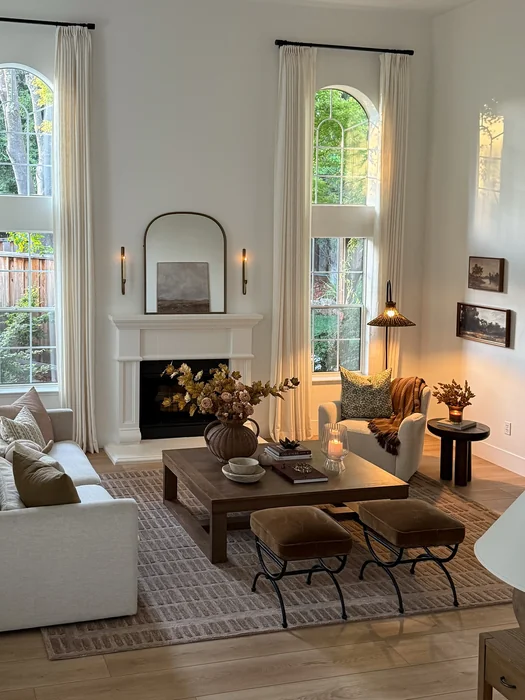 Modern Elegant Fall Living Room with Arched Windows & Fall Florals