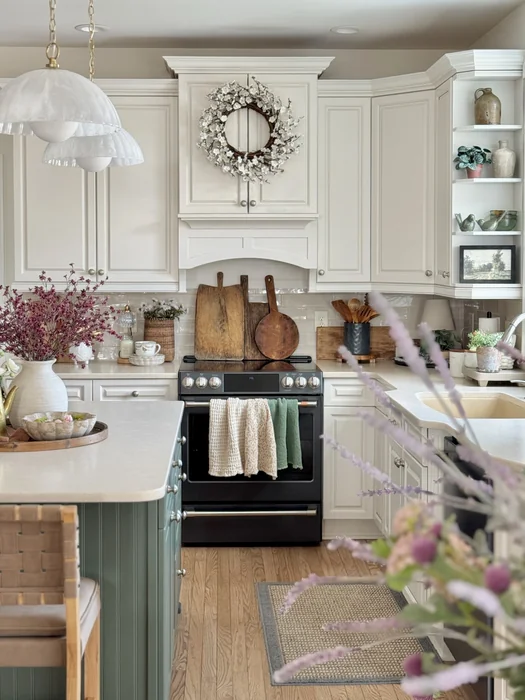 Cream Farmhouse Kitchen with Wreath Above Cabinet Decor