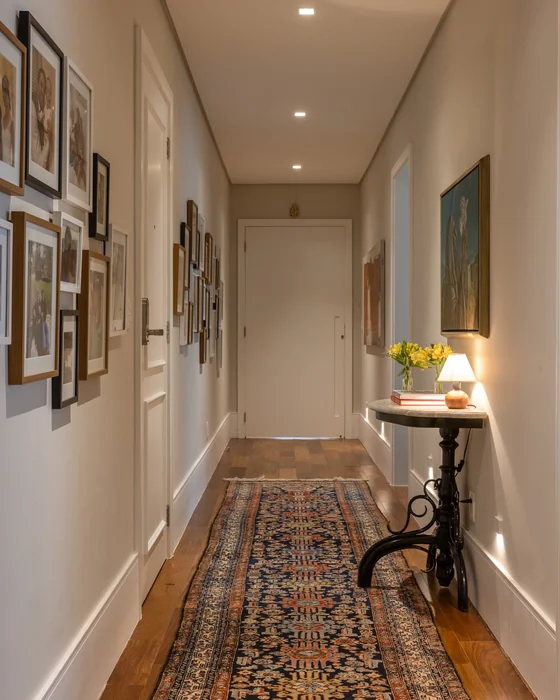 Long Hallway with Gallery Photo Wall and Antique Side Table