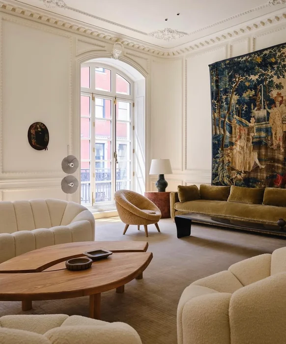 Vintage Tapestry Wall Art in High-Ceiling Parisian Living Room