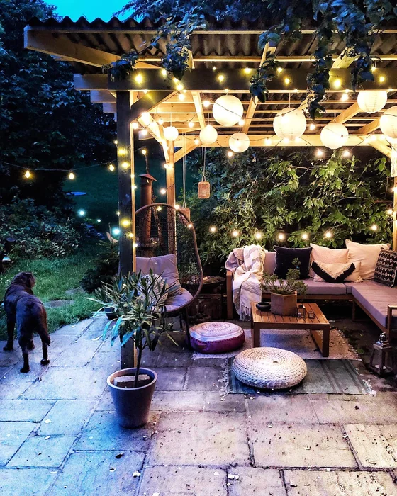 Glowing Pergola Garden with Paper Lanterns at Night