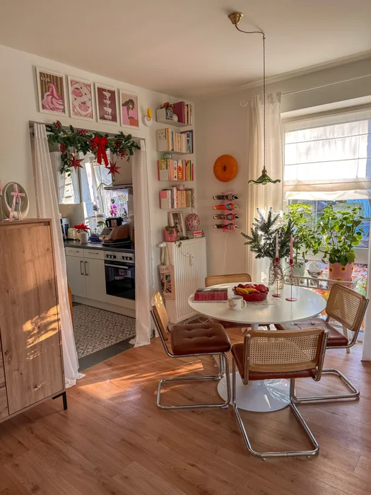 White Round Kitchen Table with Christmas Greenery & Vintage Cane Chairs