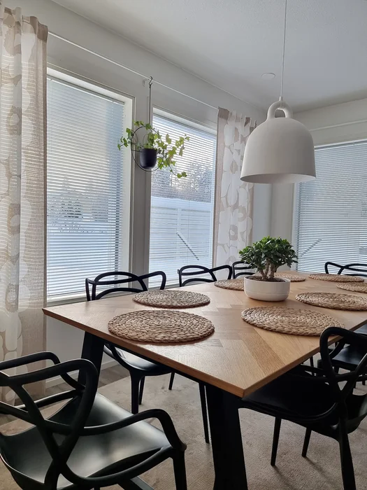 Modern Wood Kitchen Table with Bonsai Centerpiece & Black Chairs