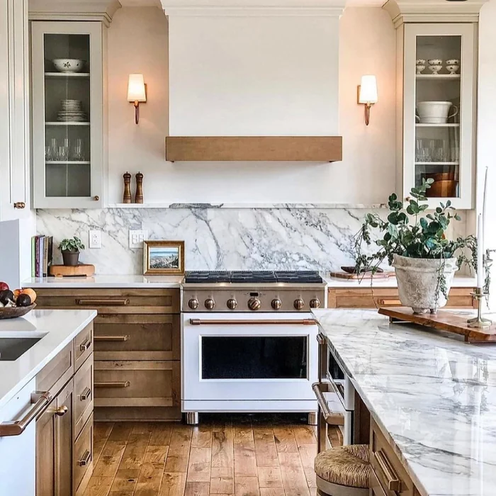 Modern Farmhouse Kitchen with Marble Backsplash and Brass Hardware