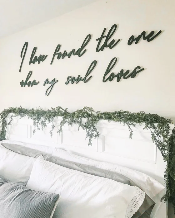 Cursive Script Quote Wall Art Above Farmhouse Bed
