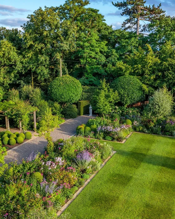 Aerial View of Formal English Garden with Topiary and Statue