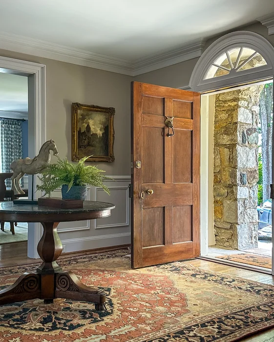 Traditional Foyer with Round Pedestal Table and Persian Rug
