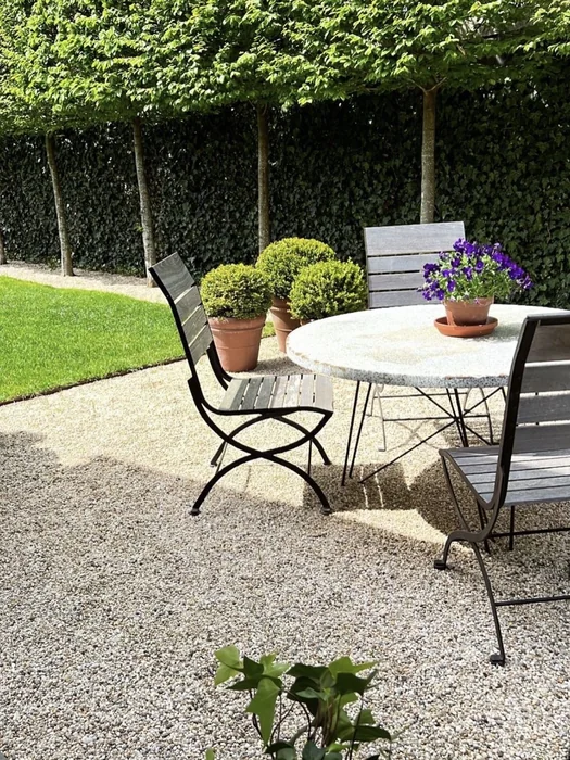 French Garden Gravel Dining Area with Pleached Trees