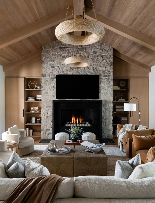 Rustic Vaulted Ceiling Living Room with Stone Fireplace Wall