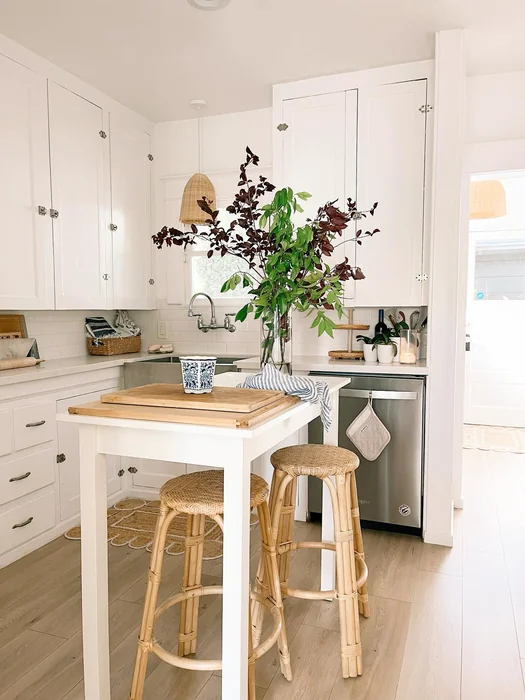 Simple White Kitchen with Dark Fall Branches & Rattan Accents