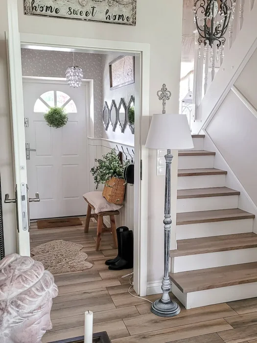 Shabby Chic Entryway with Staircase and Crystal Chandelier