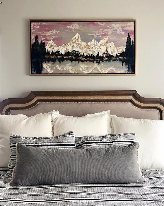 Large Landscape Painting Above Farmhouse Bed