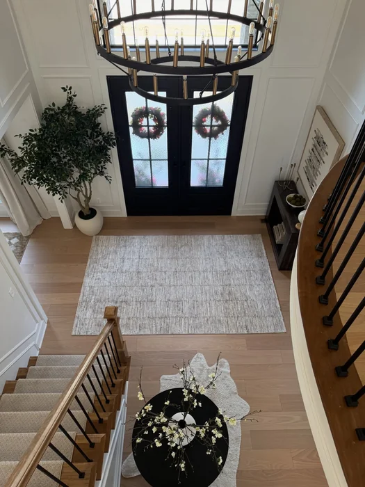 Grand Two-Storey Foyer with Christmas Wreaths and Round Table