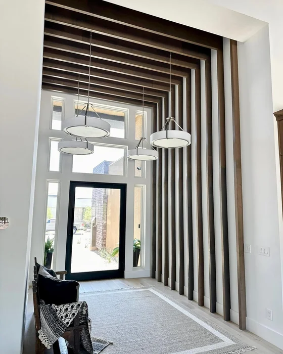 Modern Entryway with Dramatic Vertical Wood Slat Wall