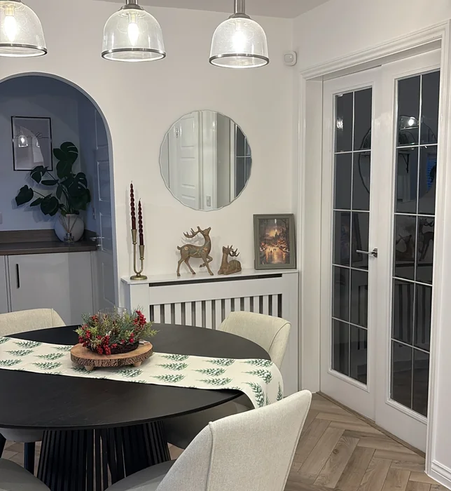 Black Round Kitchen Table with Christmas Runner & Berry Wreath