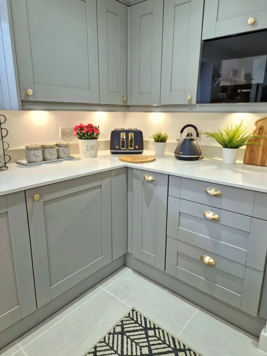 Gray Shaker Kitchen with Under-Cabinet Lighting and Counter Styling