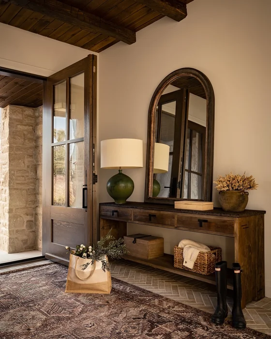 Rustic Tuscan Entryway with Arched Wood Mirror and Console Table