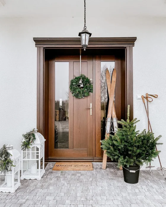 Minimalist Winter Entry with Vintage Skis