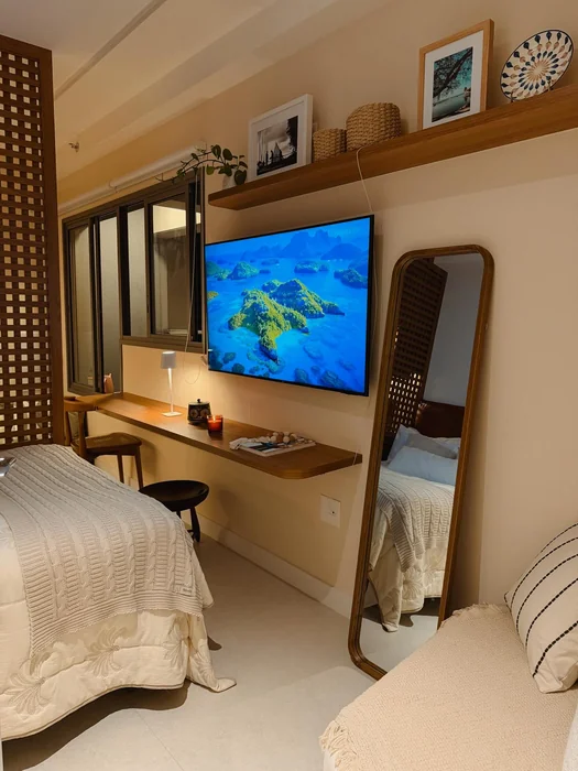 Airbnb Twin Bedroom with Warm Wood Shelving