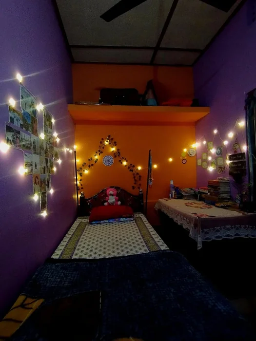 Indian Hostel Room with Bold Purple and Orange Walls