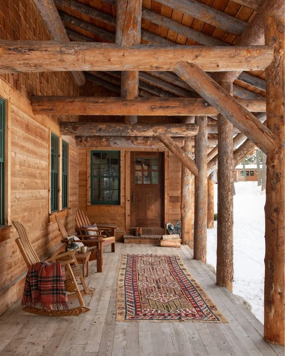 Log Cabin Winter Porch with Plaid Throw
