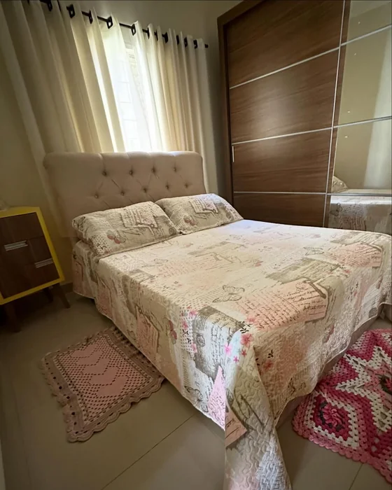 Small Cozy Bedroom with Crochet Rugs