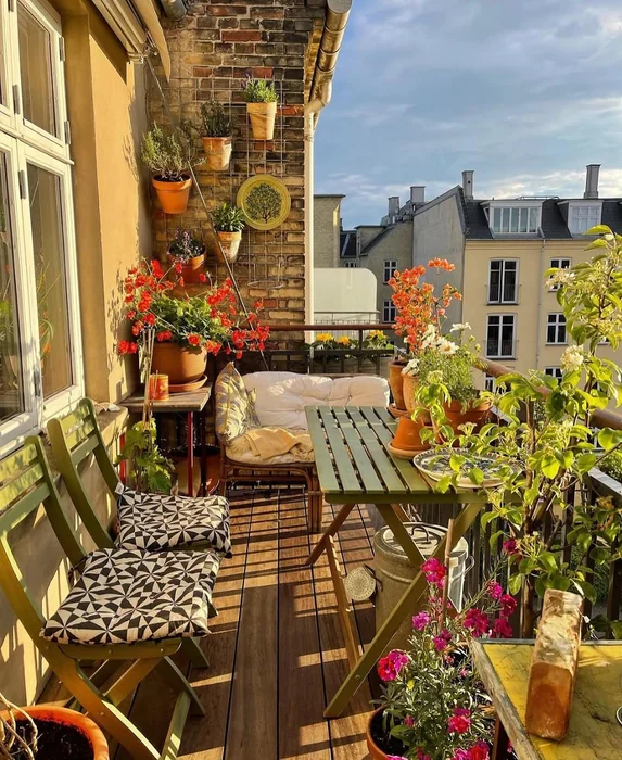 Eclectic Rooftop Balcony Garden with Terracotta and Flowers