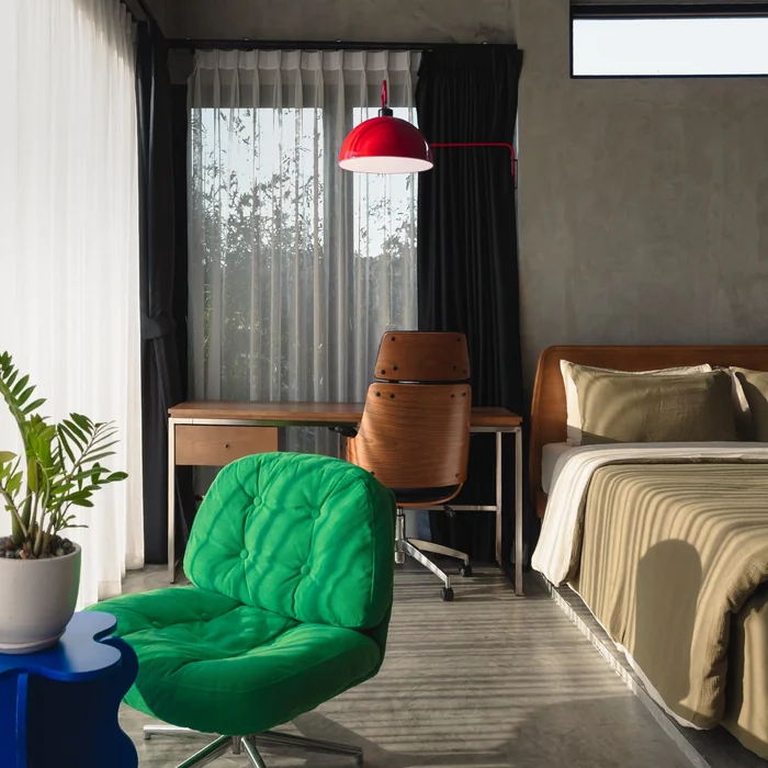 Bold & Artsy Airbnb Bedroom with Designer Chair