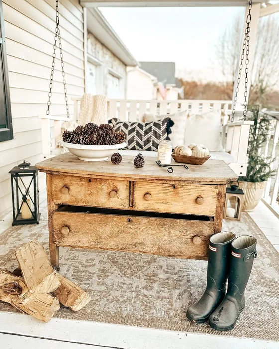 Farmhouse Porch Swing with Pinecones and Boots