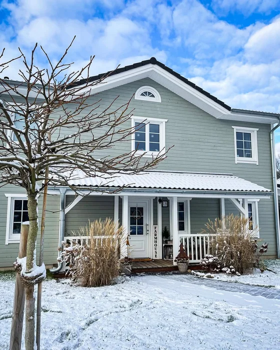 Sage Green Farmhouse in Winter Snow