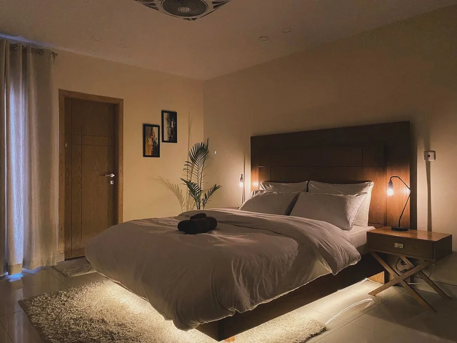 Atmospheric Airbnb Bedroom with Under-Bed Lighting