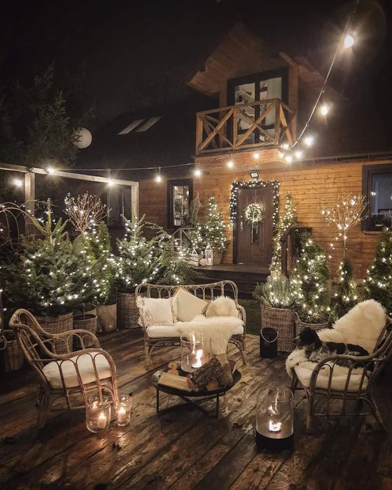 Cozy Outdoor Deck at Night with Lit Evergreens
