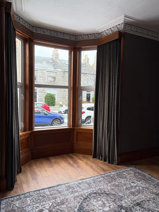 Bay Window with Dark Curtains