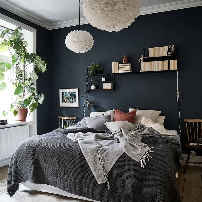 Dark Navy Bedroom with Floating Shelves and Framed Art Wall