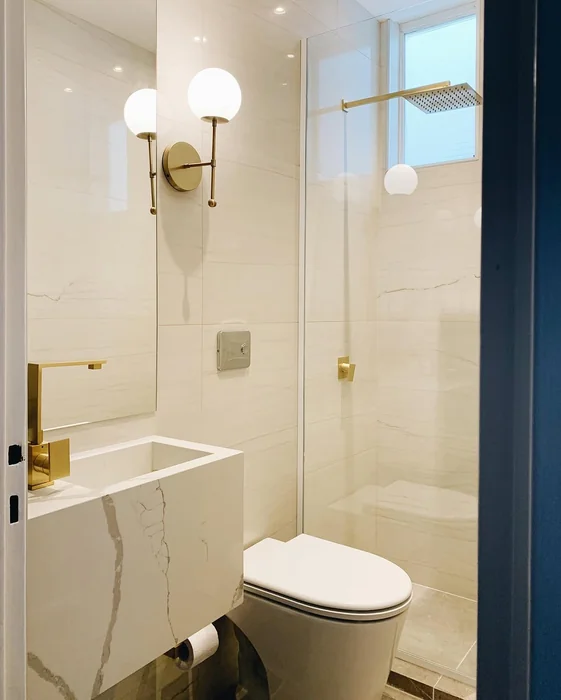 Small Modern Bathroom with Marble Tiles & Gold Fixtures